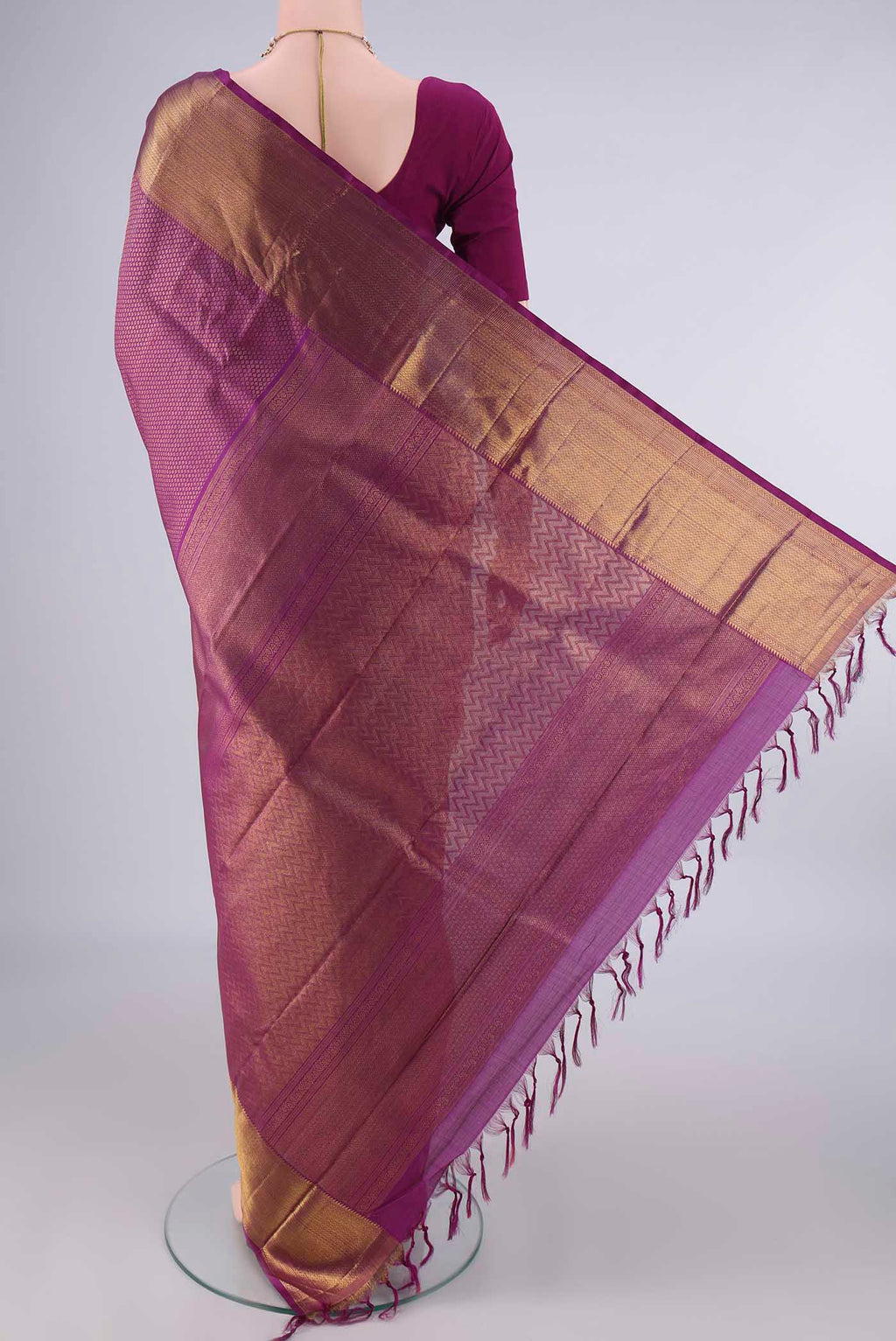 Flat view of Pure Silk Magenta Kanchipuram Saree with Zari Brocade on the body and Zari Border. 
