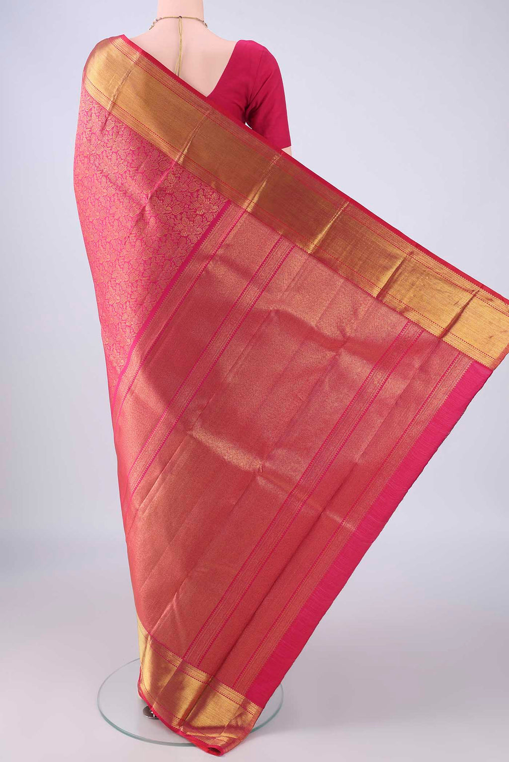 Flat view of Pink Kanchipuram Silk Saree with Zari Brocade on the body and Zari Border. 
