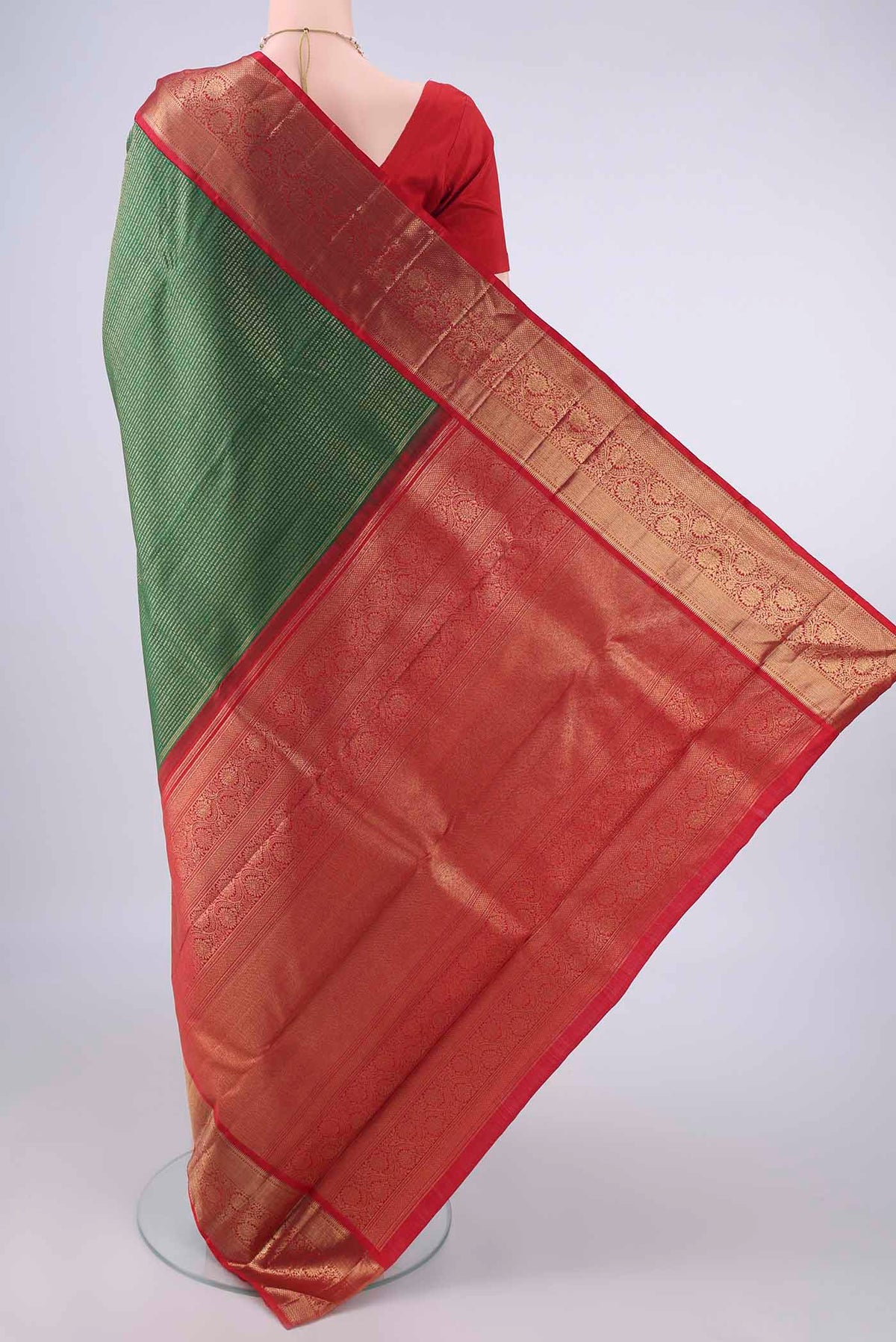 Flat view of Pure Silk Green Kanjivaram Saree with Zari Brocade on the body and Zari Border. 