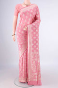 Pure Silk Peach Banarasi Saree with Zari Butta on the body and Zari Border.  displayed on a mannequin