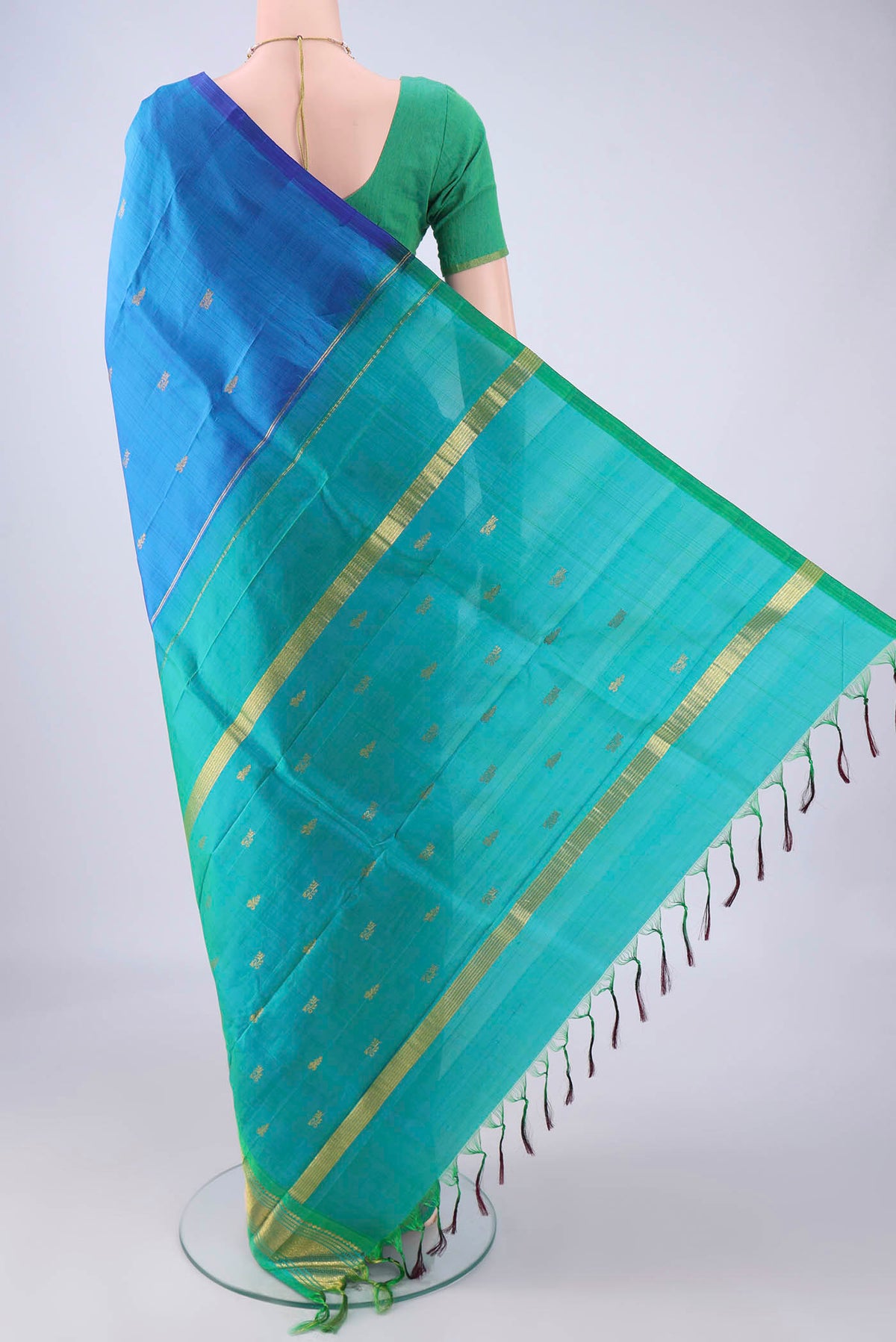 Flat view of Blue Kanjivaram Silk Saree with Zari Butta on the body and One Side Border. 