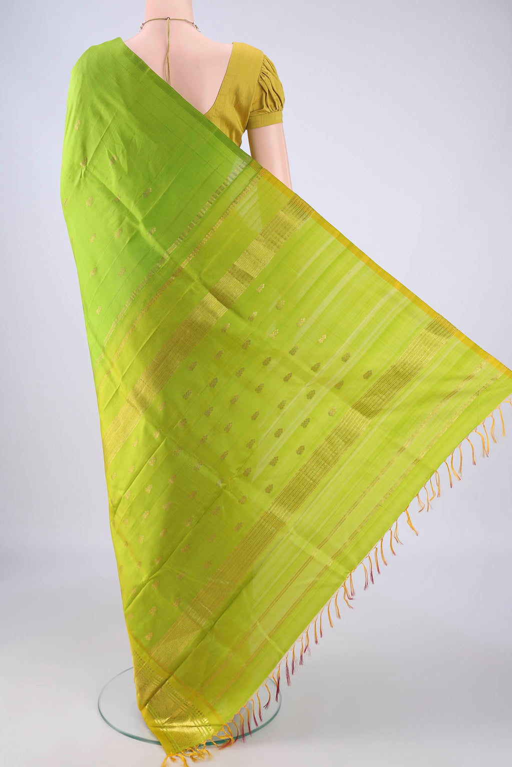 Flat view of Light Green Kanjivaram Silk Saree with Zari Butta on the body and One Side Border. 