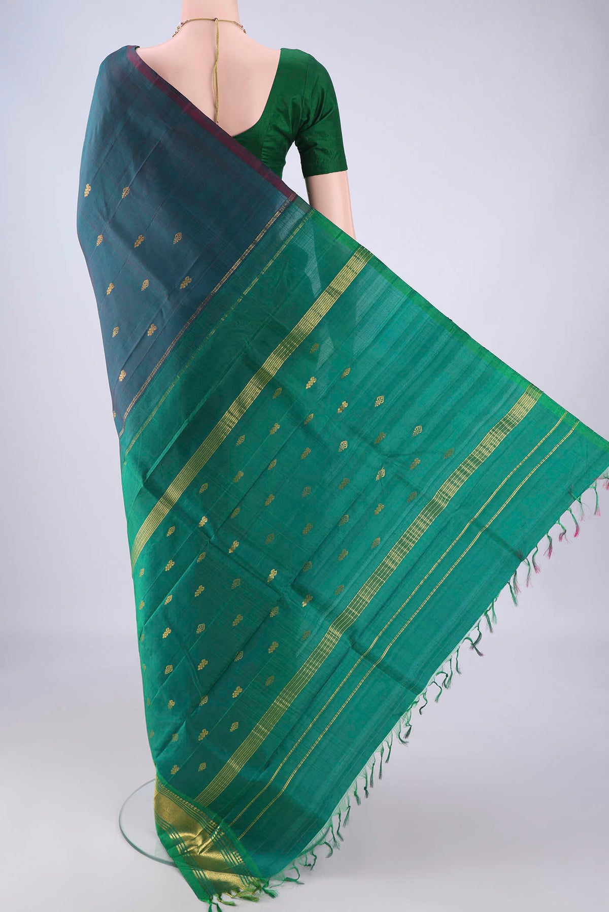 Flat view of Peacock Blue Dual Tone Kanjivaram Silk Saree with Zari Butta on the body and One Side Border. 