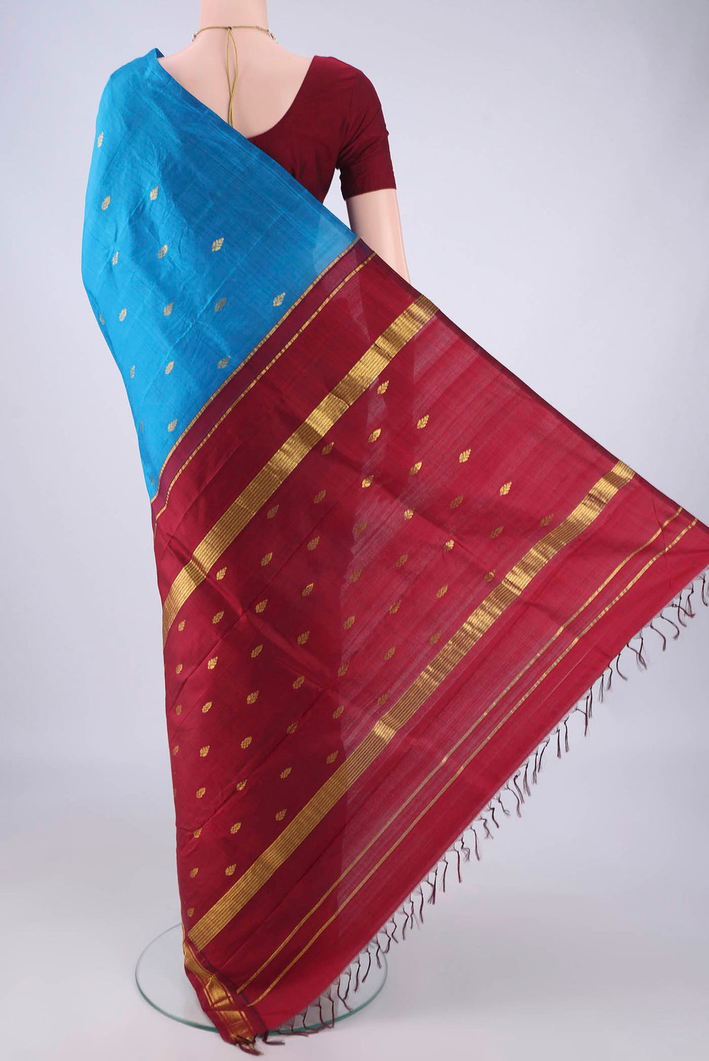 Flat view of Blue Kanjivaram Silk Saree with Zari Butta on the body and One Side Border. 