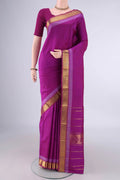 Pure Silk Magenta Kanjivaram Saree with Plain Body and Zari Border.  displayed on a mannequin