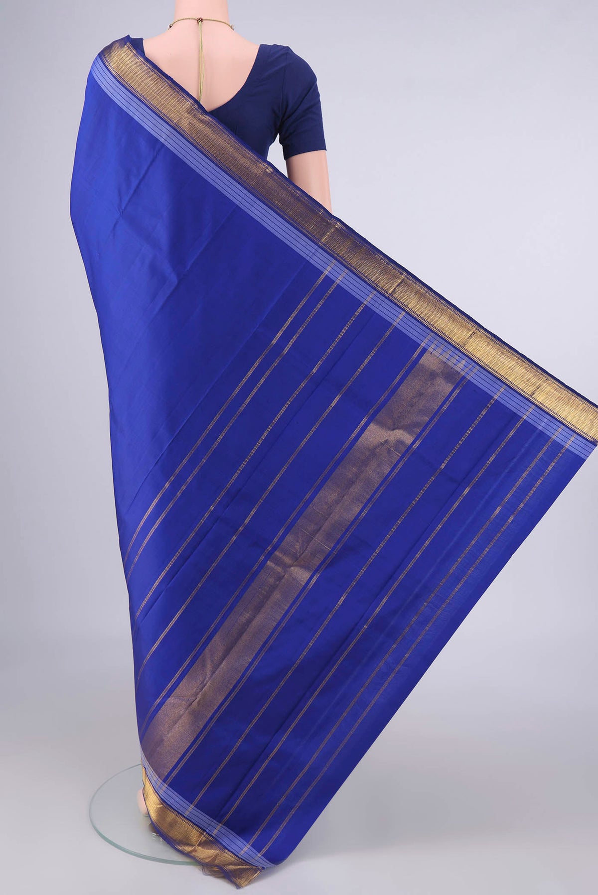 Flat view of Royal Blue Kanjivaram Saree with Plain Body and Zari Border. 