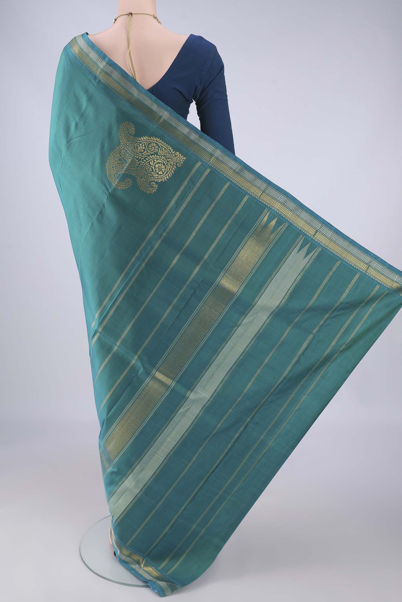 Flat view of Sea Green Kanchipuram Silk Saree with Plain Body and Zari Border. 