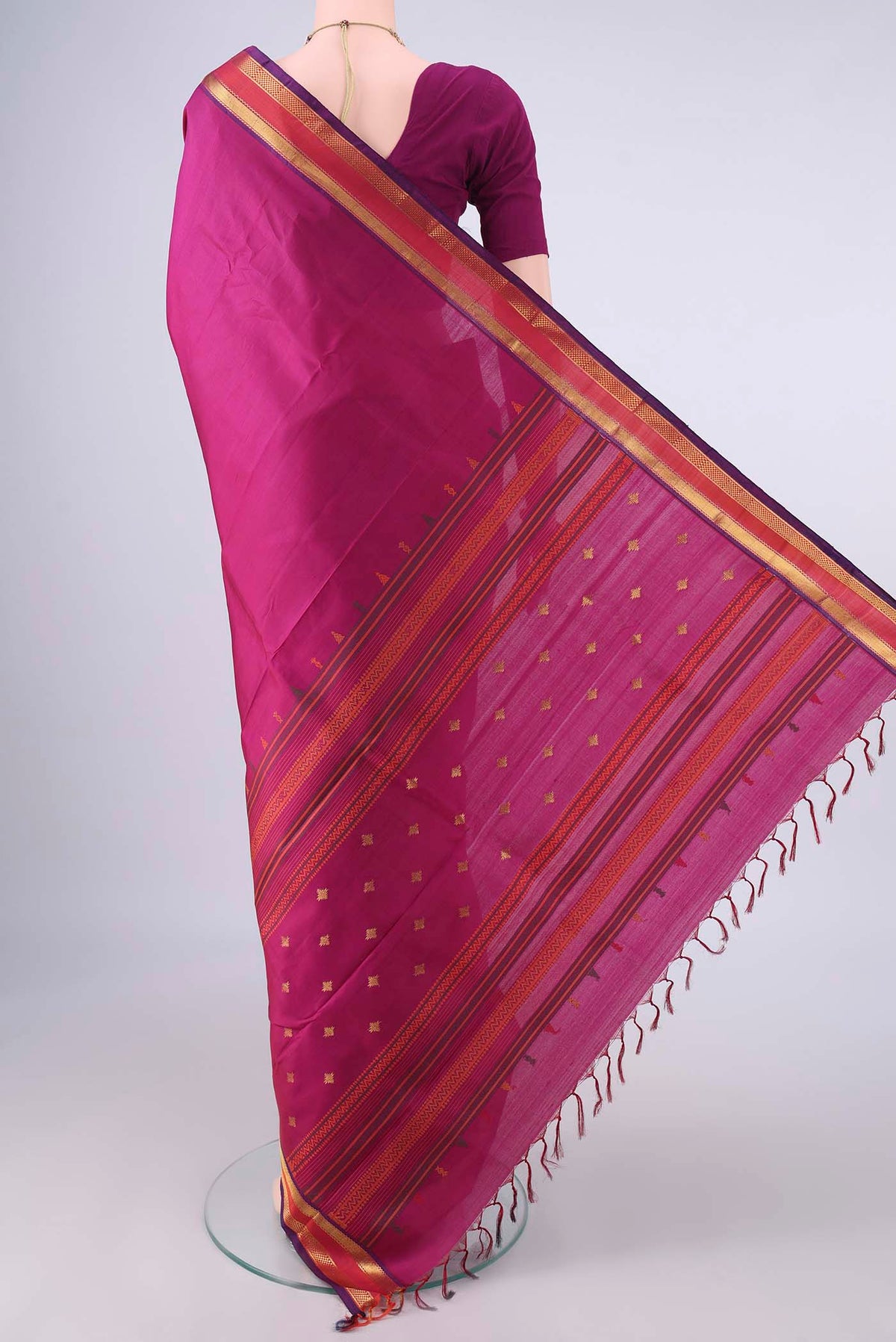 Flat view of Pure Silk Dark Pink Kanjivaram Saree with Plain Body and Zari Border. 