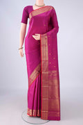 Pure Silk Magenta Kanjivaram Silk Saree with Zari Butta on the body and Zari Border.  displayed on a mannequin