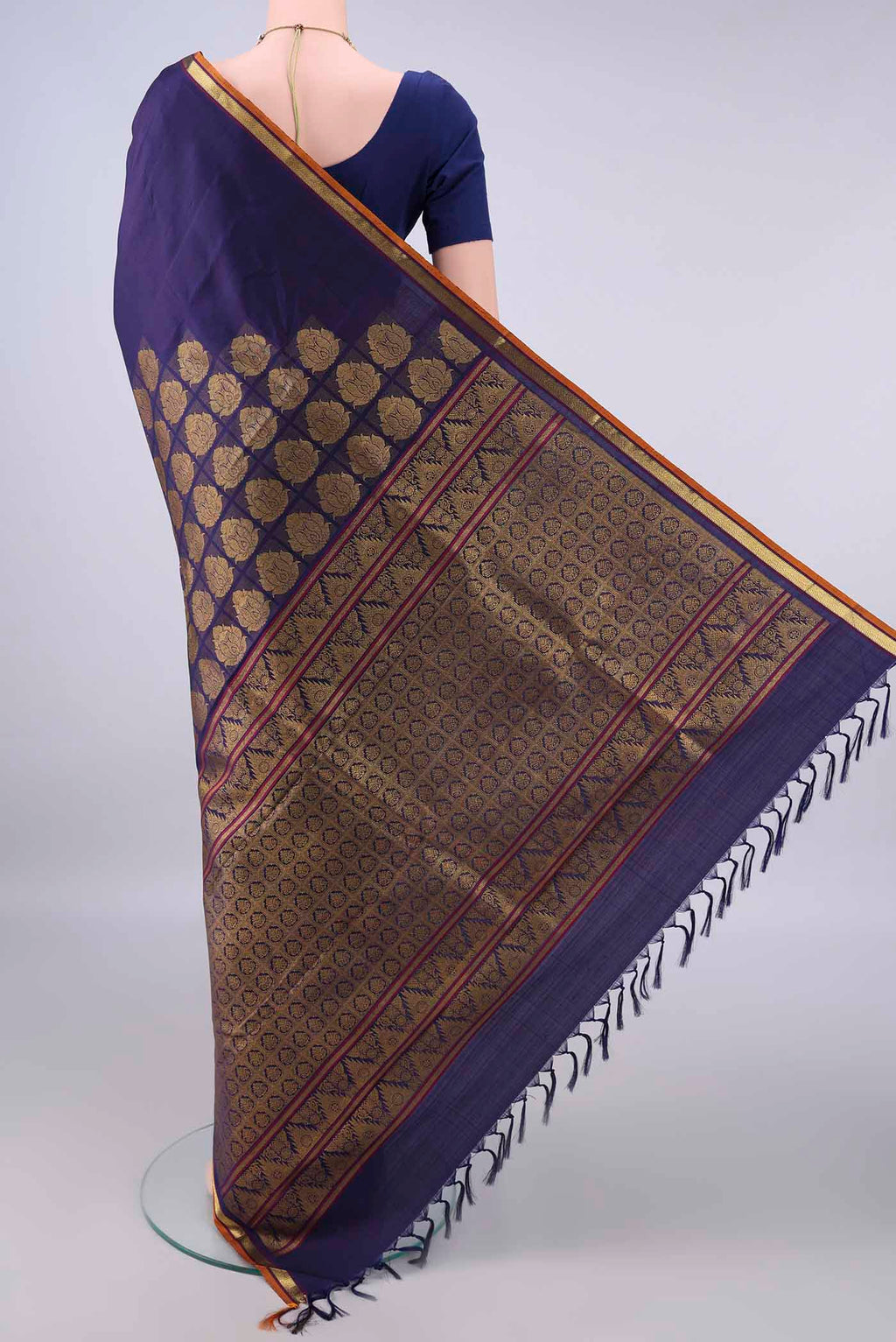 Flat view of Pure Silk Navy Blue Kanjivaram Saree with Zari Butta on the body and Zari Border. 