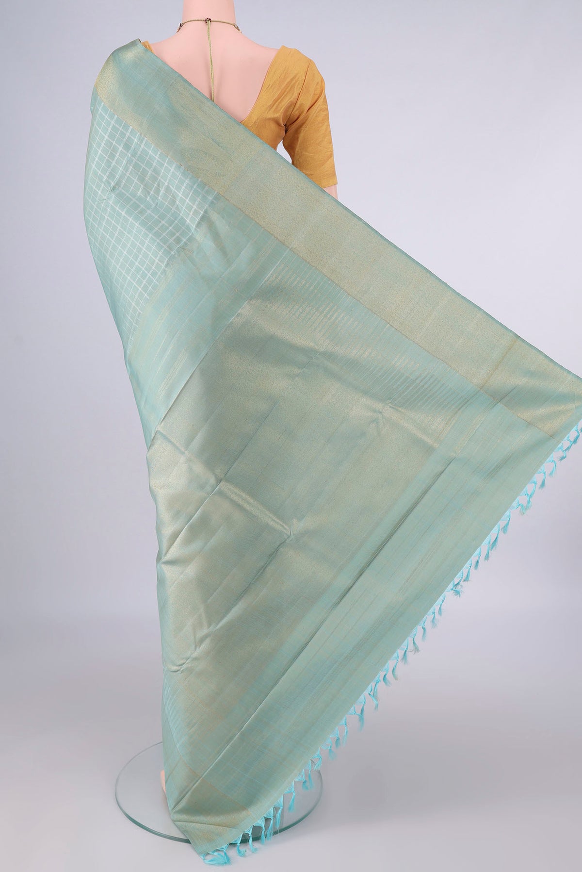 Flat view of Pure Silk Pure Zari Sky Blue Kanjivaram Saree with Checked design on the body and Zari Border. 