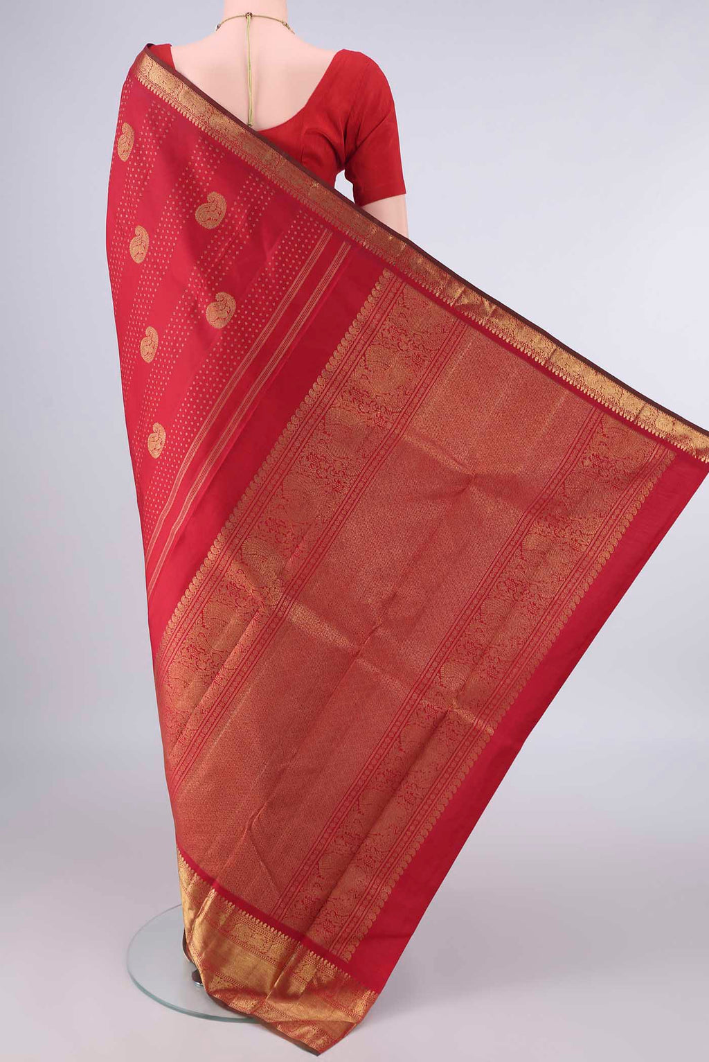 Flat view of Pure Silk Pure Zari Red Kanjivaram Saree with Zari Butta on the body and Zari Border. 