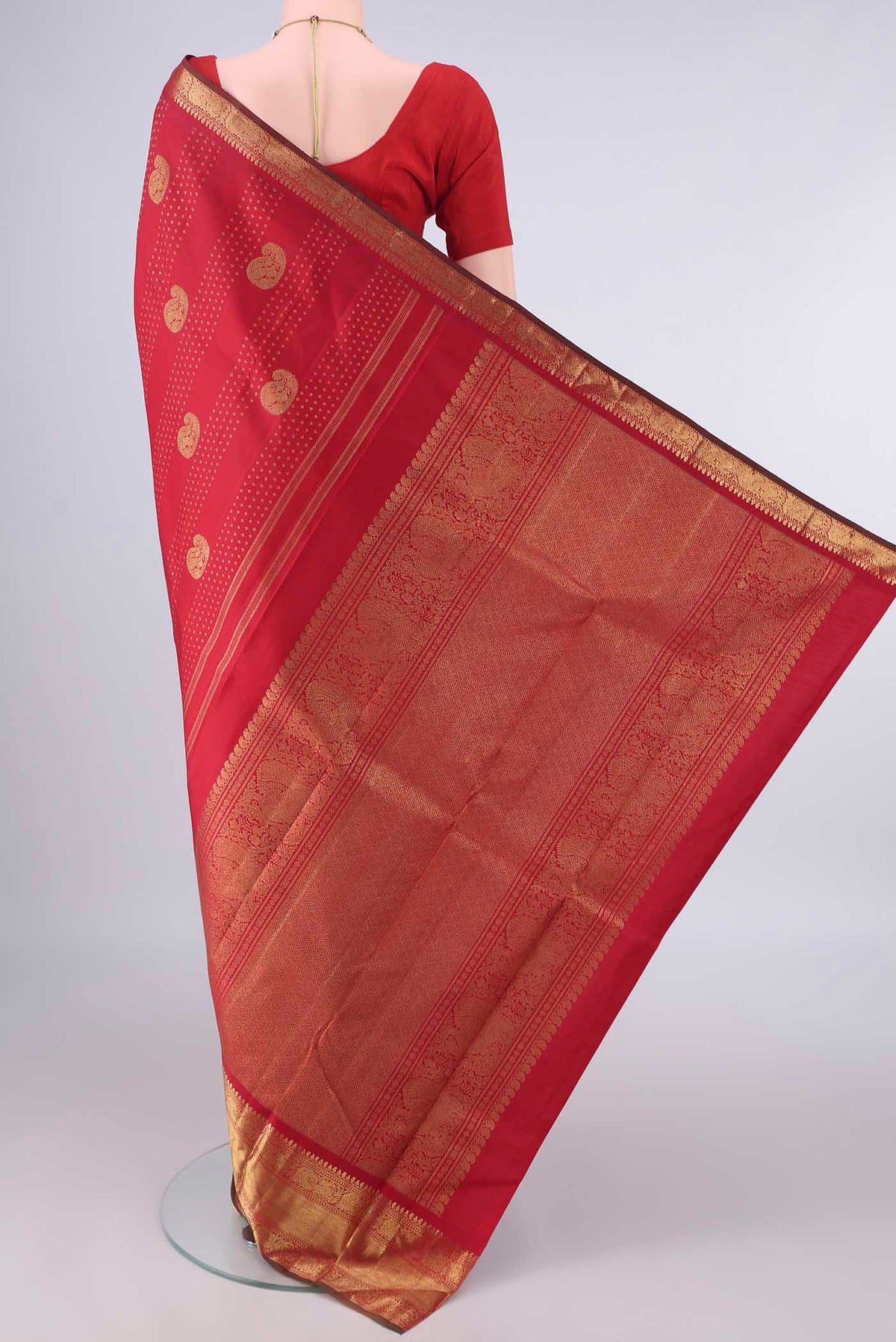 Flat view of Pure Silk Pure Zari Red Kanjivaram Saree with Zari Butta on the body and Zari Border. 