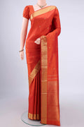 Pure Silk Pure Zari Brick Orange Kanjivaram Saree with Zari Butta on the body and Zari Border.  displayed on a mannequin