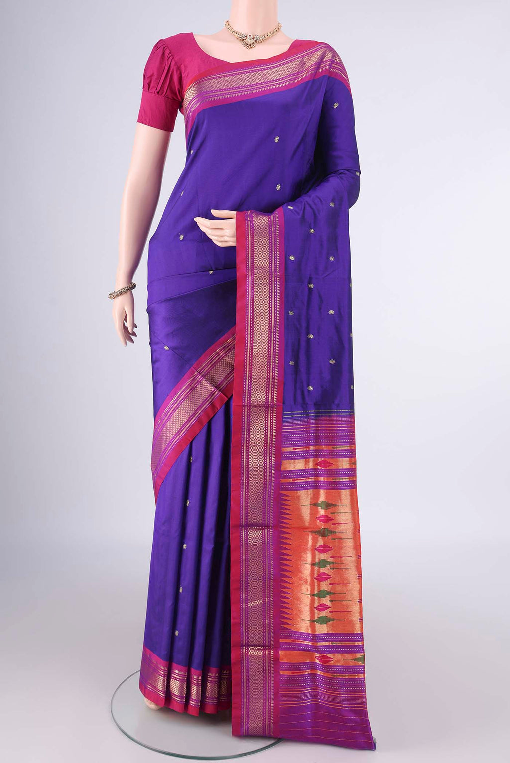 Pure Silk Blue Paithani Saree with Zari Butta on the body and Zari Border.  displayed on a mannequin