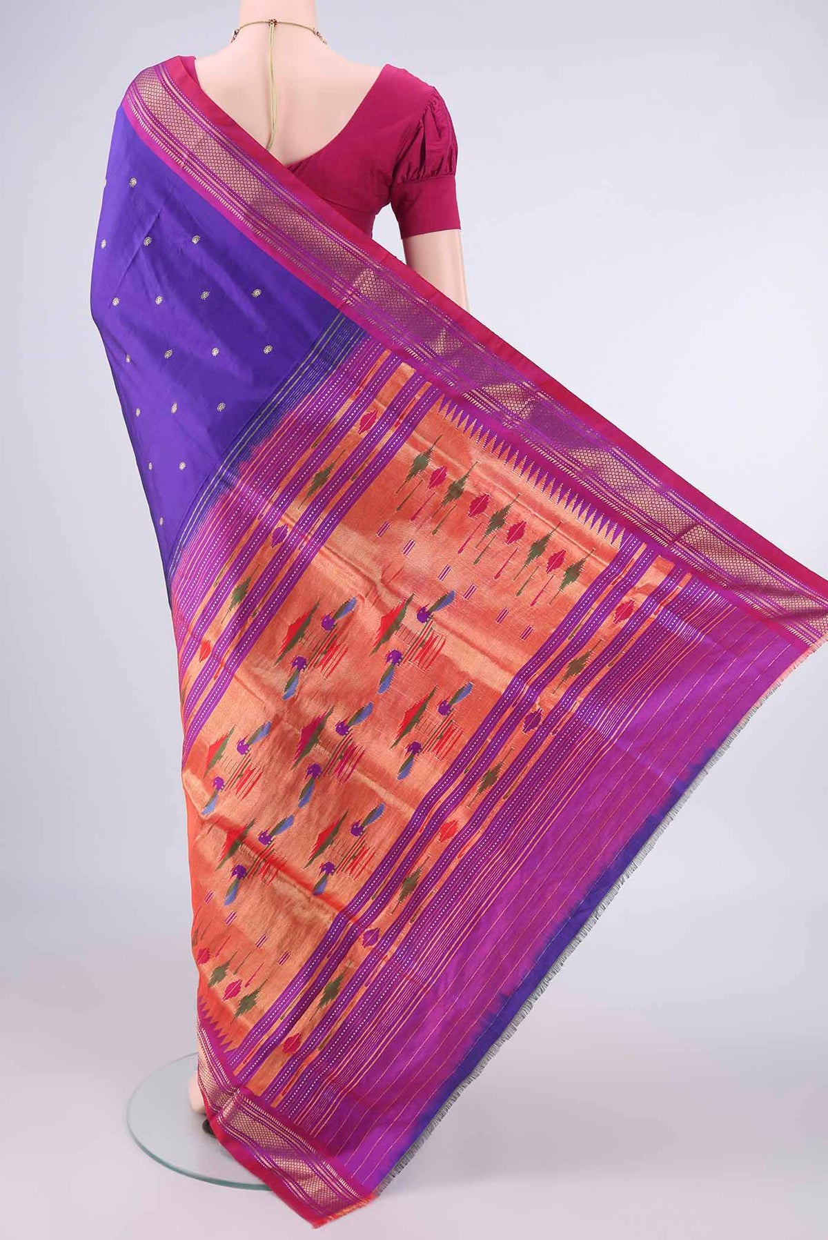Flat view of Pure Silk Blue Paithani Saree with Zari Butta on the body and Zari Border. 
