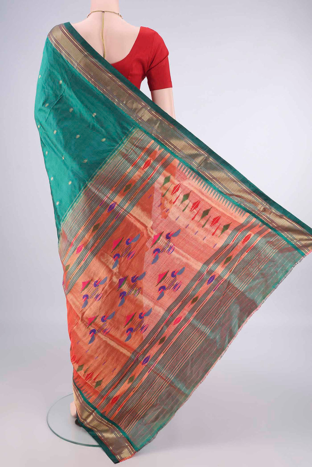 Flat view of Pure Silk Bottle Green Paithani Saree with Plain Body and Zari Border. 