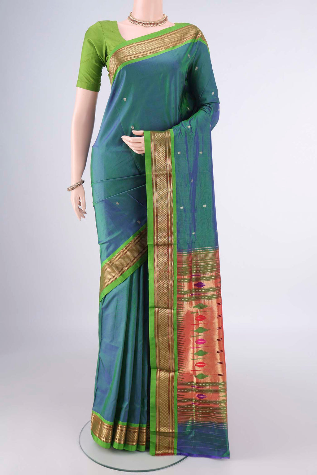 Pure Silk Peacock Blue Paithani Saree with Plain Body and Zari Border.  displayed on a mannequin