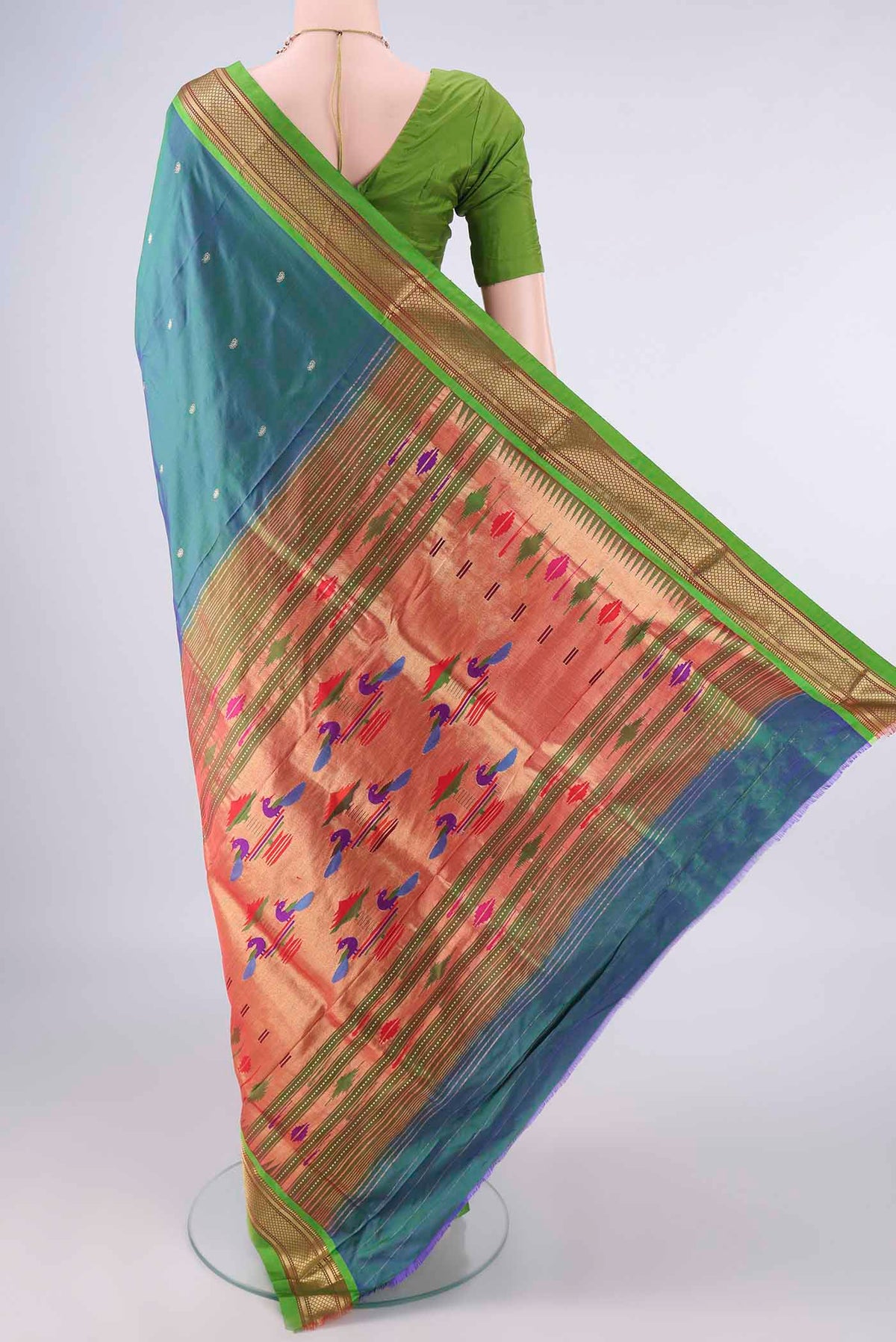 Flat view of Pure Silk Peacock Blue Paithani Saree with Plain Body and Zari Border. 