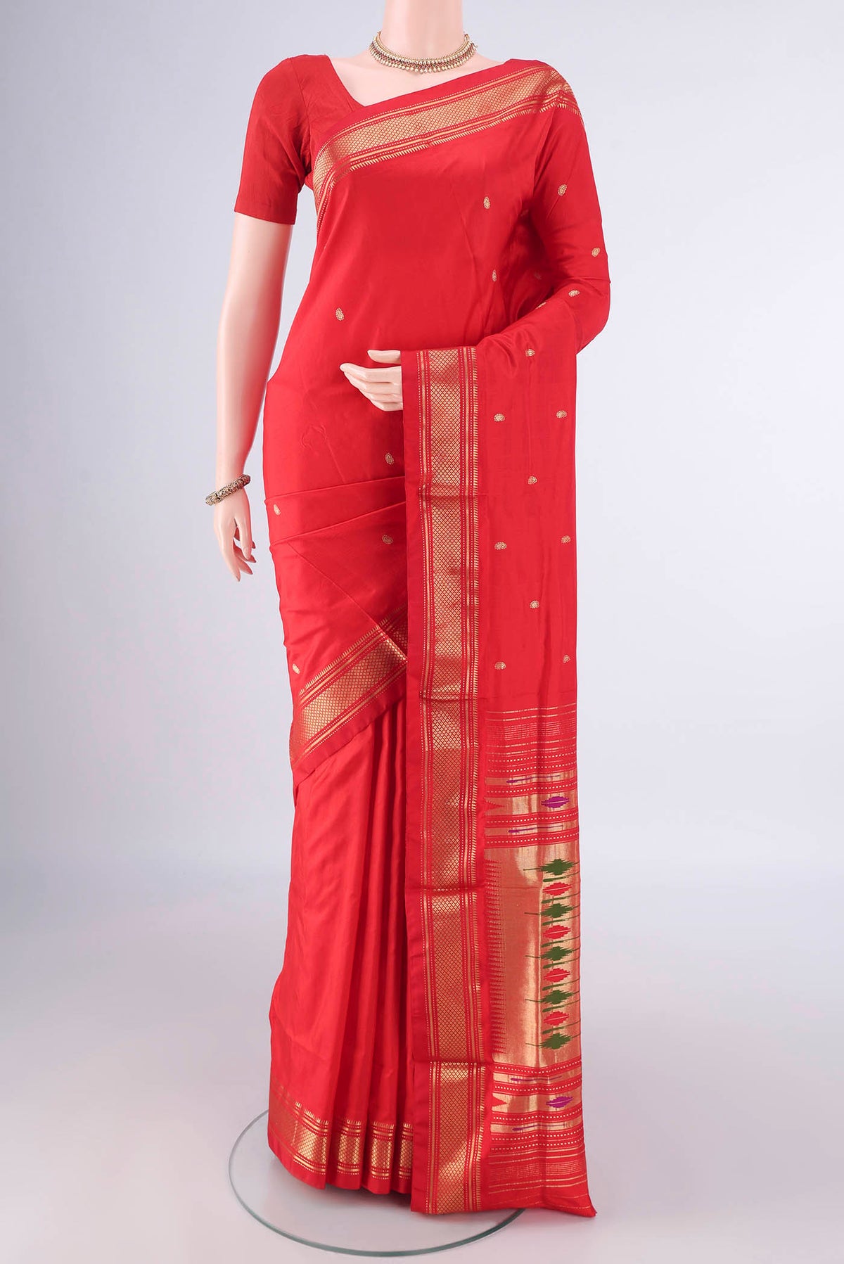 Pure Silk Red Paithani Saree with Plain Body and Zari Border.  displayed on a mannequin