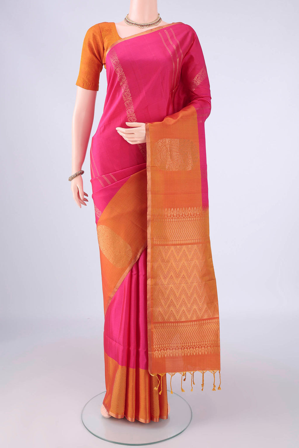 Pure Silk Rani Pink Soft Silk Saree with Stripes on the body and Fancy Border.  displayed on a mannequin