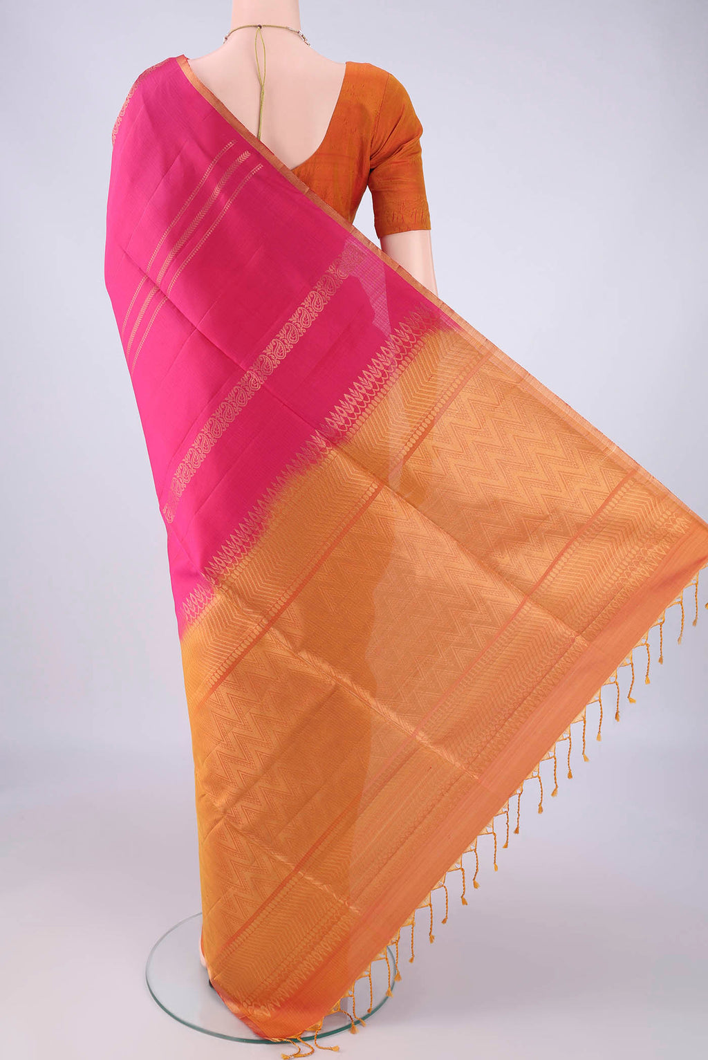 Flat view of Pure Silk Rani Pink Soft Silk Saree with Stripes on the body and Fancy Border. 