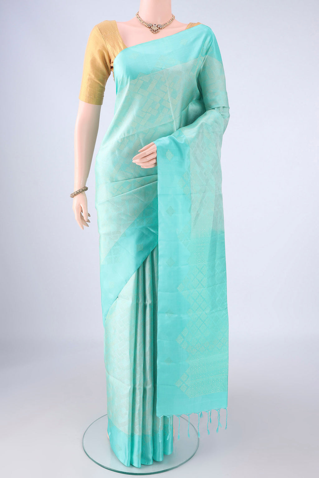 Pure Silk Turquoise Soft Silk Saree with Zari Brocade on the body and Zari Border.  displayed on a mannequin