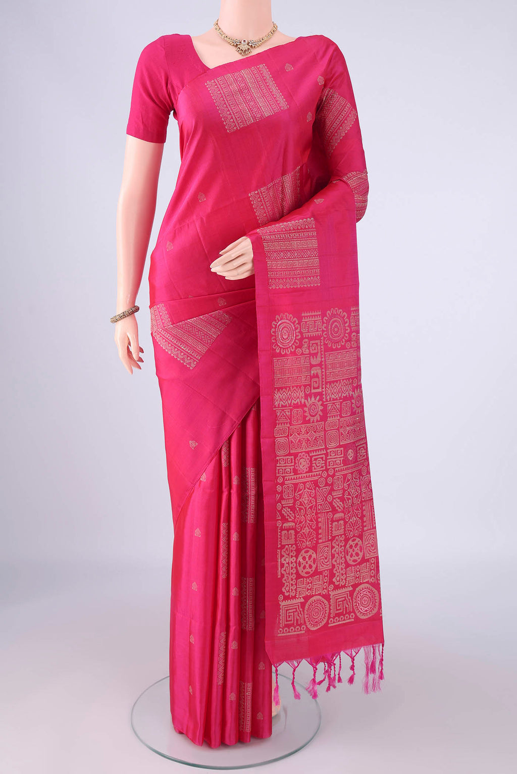 Pure Silk Rani Pink Soft Silk Saree with Thread Butta on the body and Plain Border.  displayed on a mannequin