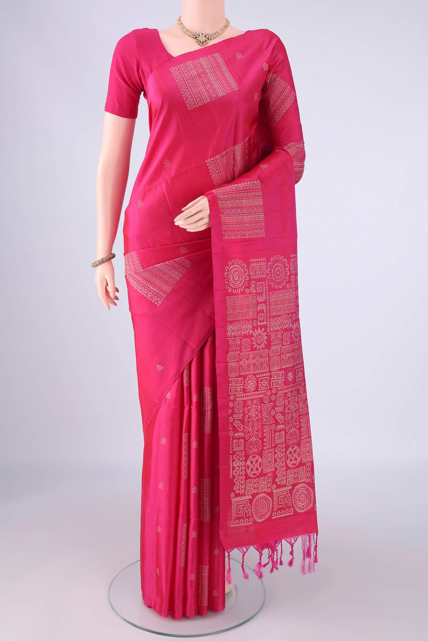 Pure Silk Rani Pink Soft Silk Saree with Thread Butta on the body and Plain Border.  displayed on a mannequin