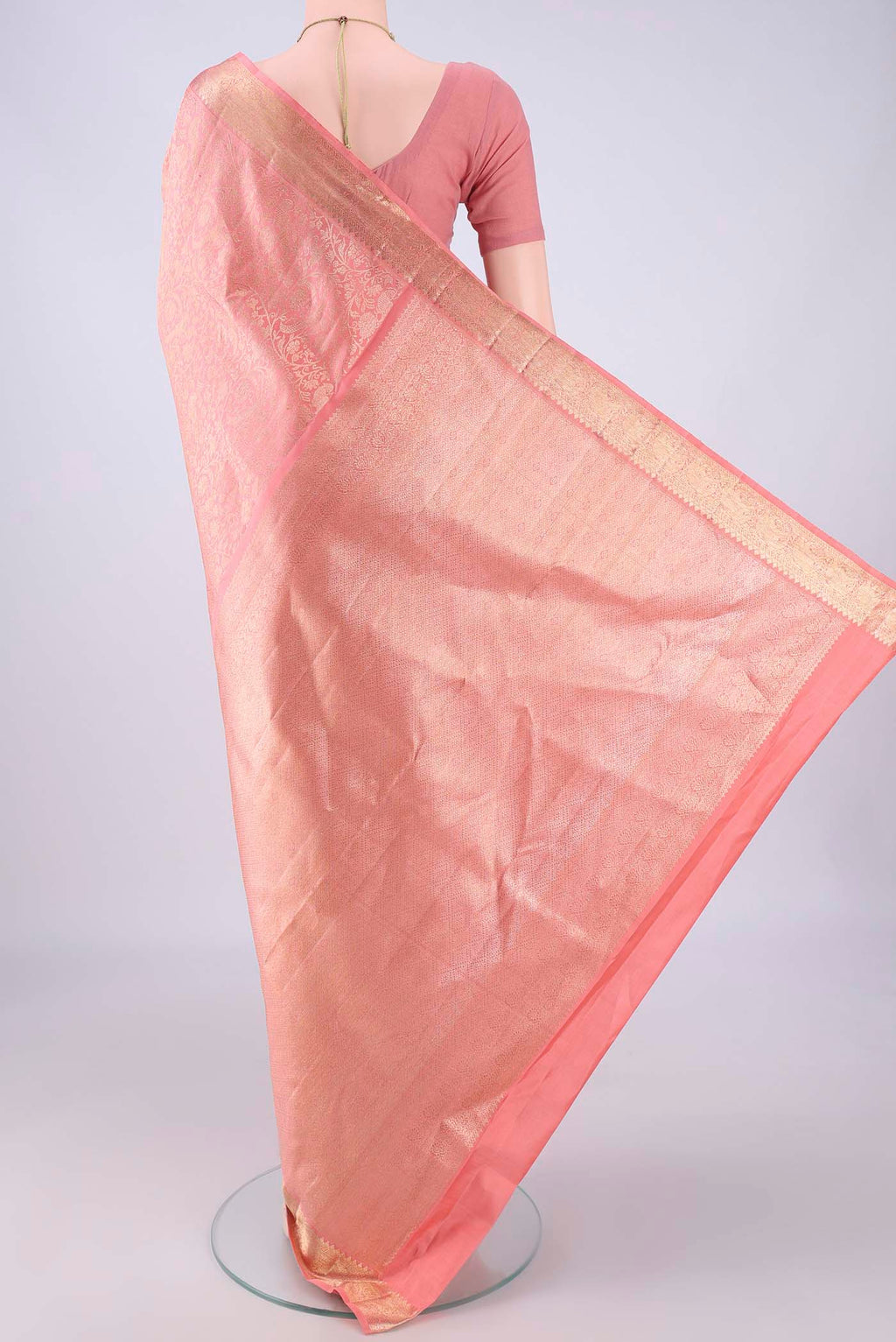 Flat view of Peach Kanchipuram Silk Saree with Zari Brocade on the body and Zari Border. 
