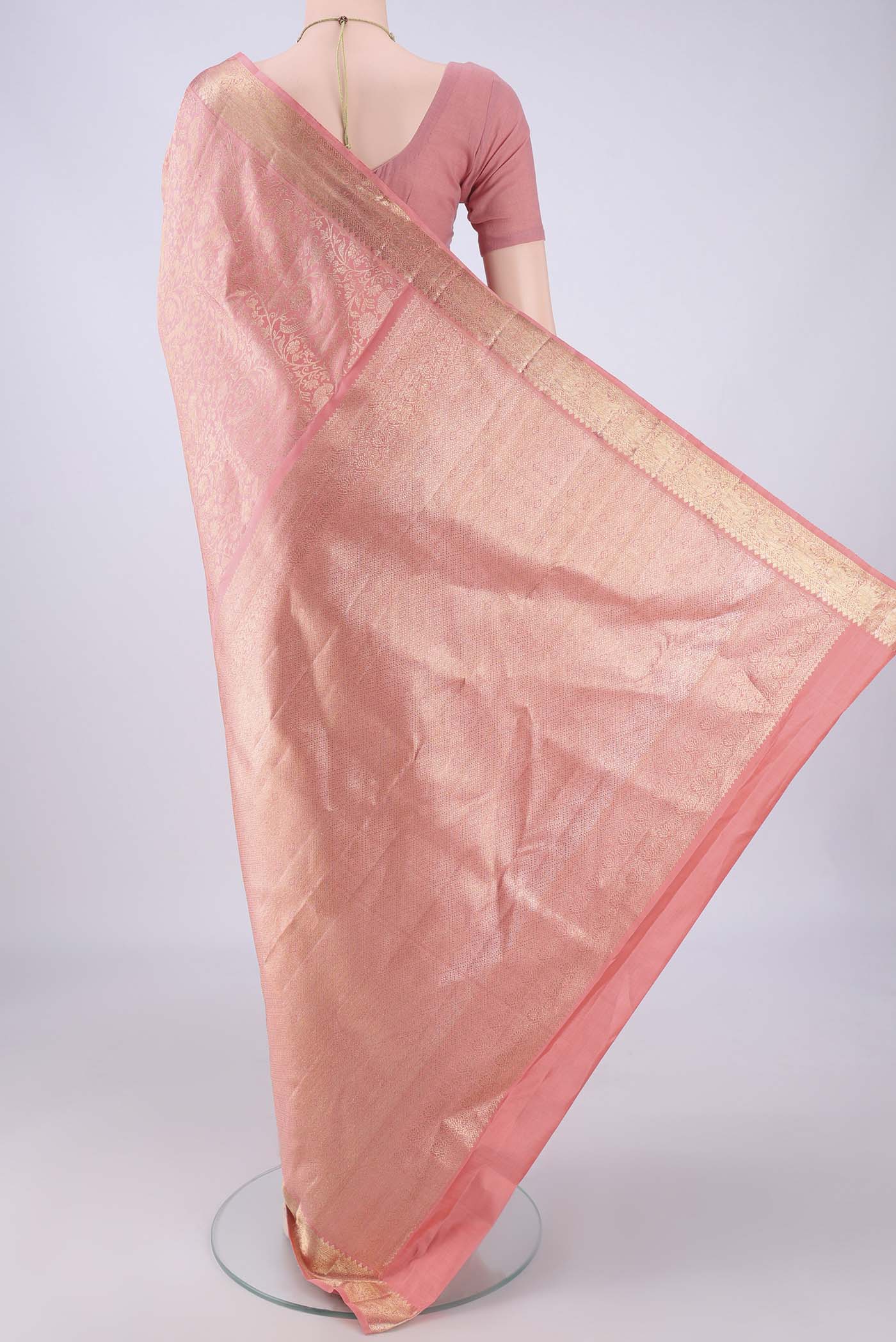 Flat view of Peach Kanchipuram Silk Saree with Zari Brocade on the body and Zari Border. 