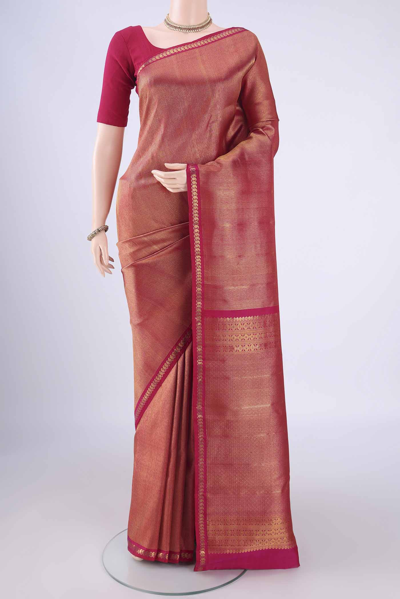 Pink Kanchipuram Silk Saree with Zari Brocade on the body and Zari Border.  displayed on a mannequin