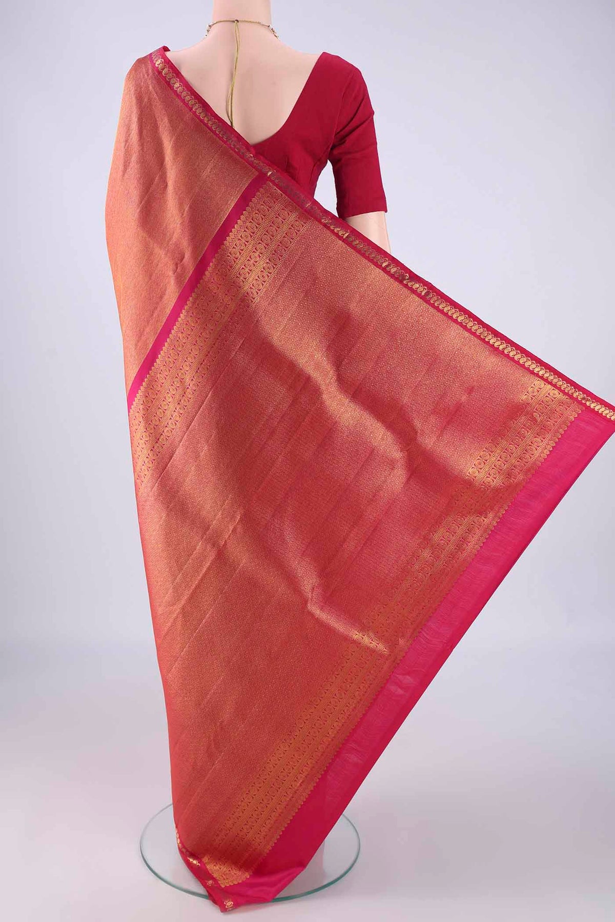 Flat view of Pink Kanchipuram Silk Saree with Zari Brocade on the body and Zari Border. 