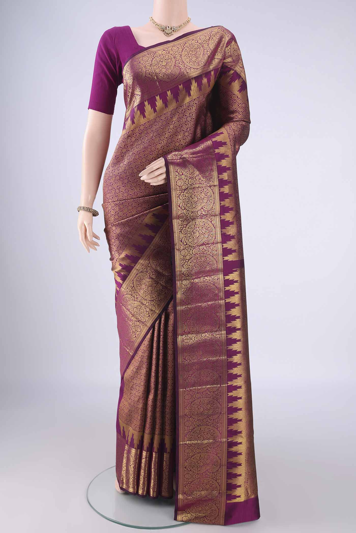 Purple Kanchipuram Silk Saree with Zari Brocade on the body and Zari Border.  displayed on a mannequin
