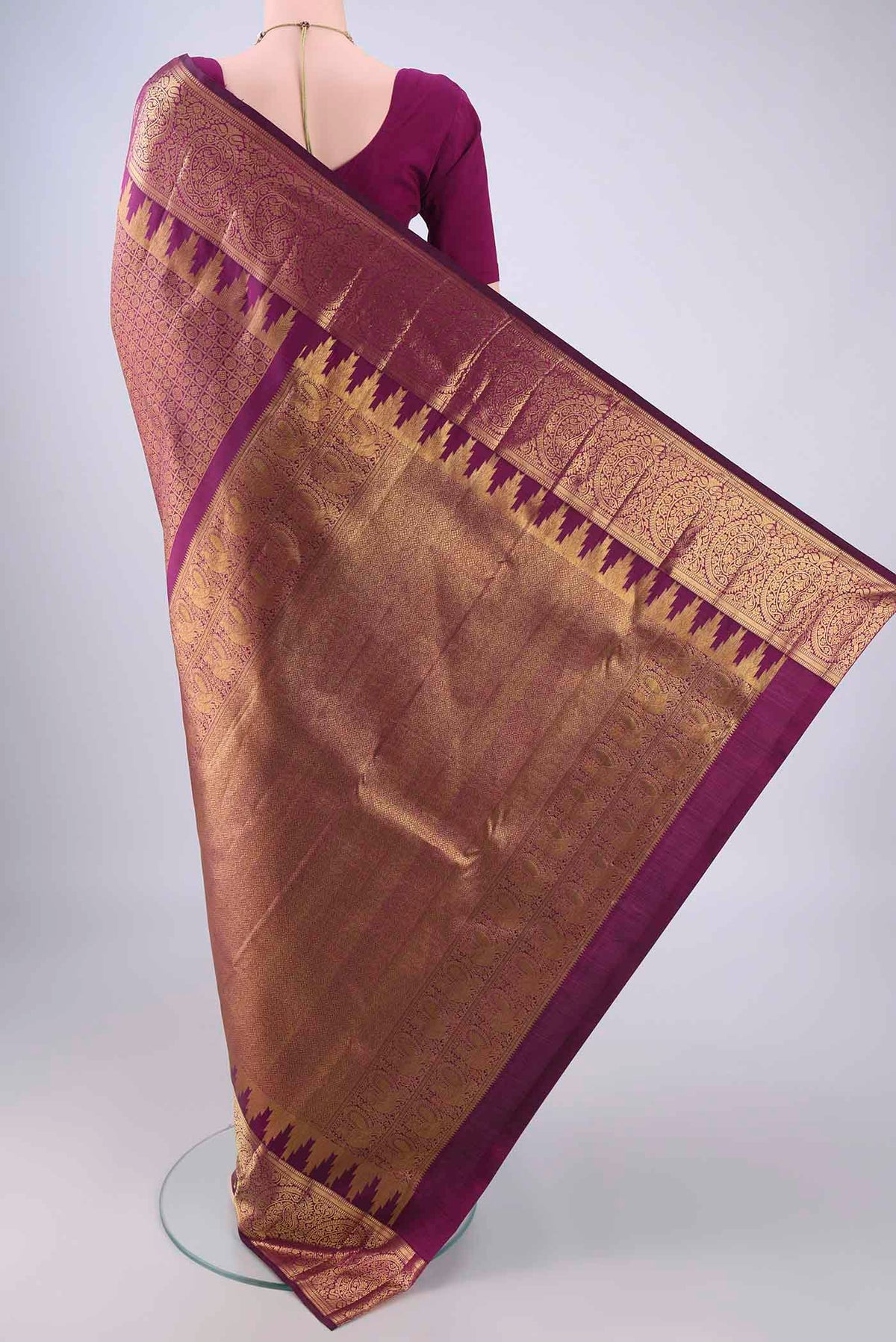 Flat view of Purple Kanchipuram Silk Saree with Zari Brocade on the body and Zari Border. 