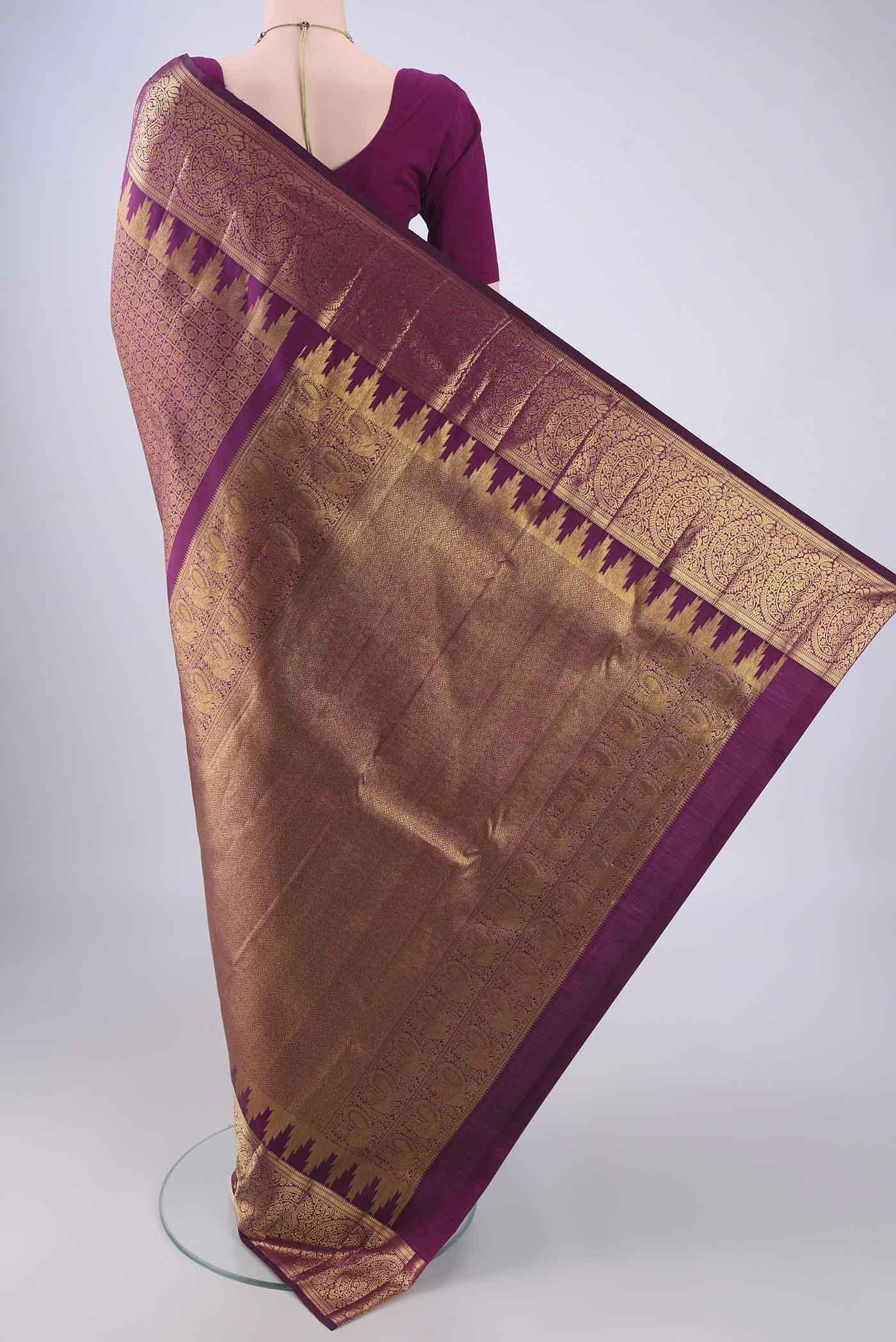 Flat view of Purple Kanchipuram Silk Saree with Zari Brocade on the body and Zari Border. 