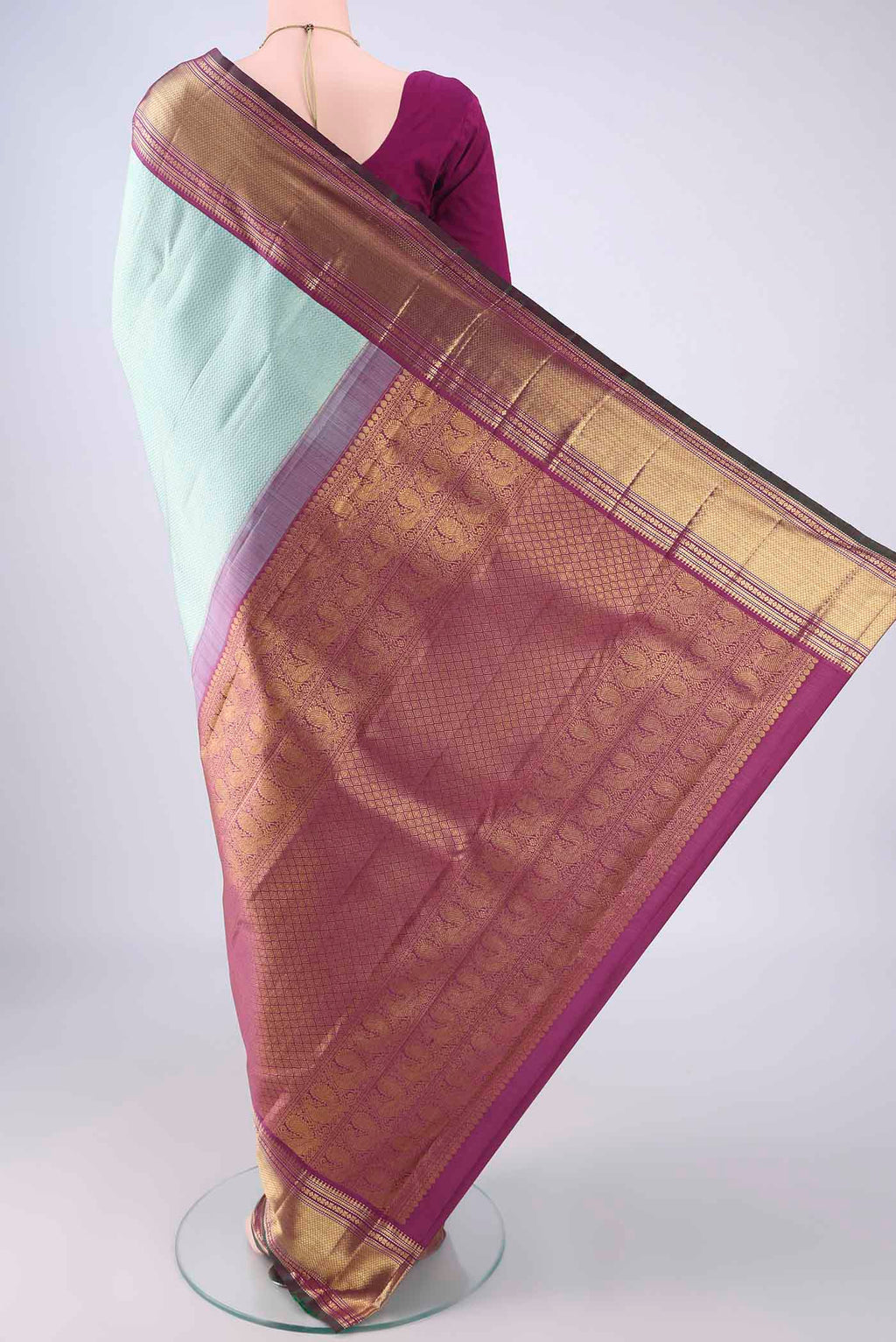 Flat view of Light Blue Kanchipuram Silk Saree with Zari Brocade on the body and Zari Border. 