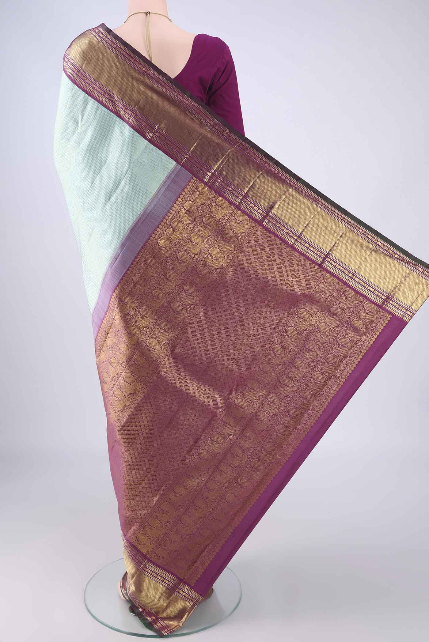 Flat view of Light Blue Kanchipuram Silk Saree with Zari Brocade on the body and Zari Border. 