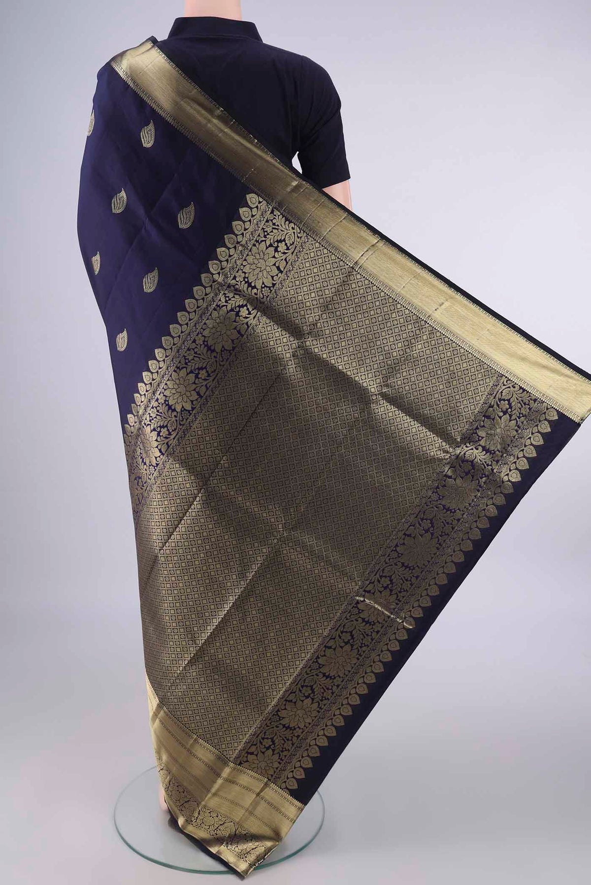 Flat view of Pure Silk Navy Blue Kanjivaram Saree with Zari Butta on the body and Zari Border. 