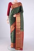Bottle Green Kanchipuram Silk Saree with Checked design on the body and Zari Border.  displayed on a mannequin