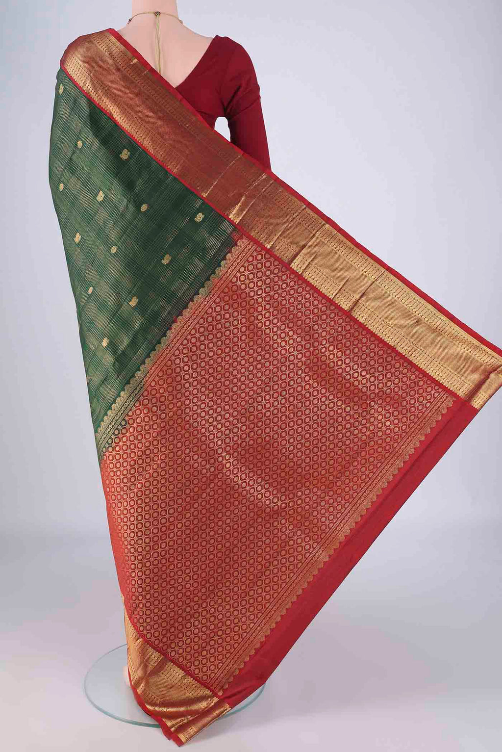 Flat view of Bottle Green Kanchipuram Silk Saree with Checked design on the body and Zari Border. 