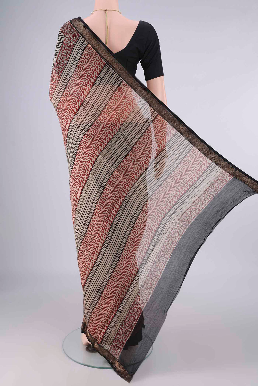 Flat view of Beige Maheshwari Cotton Saree with Printed design on the body and Zari Border. 