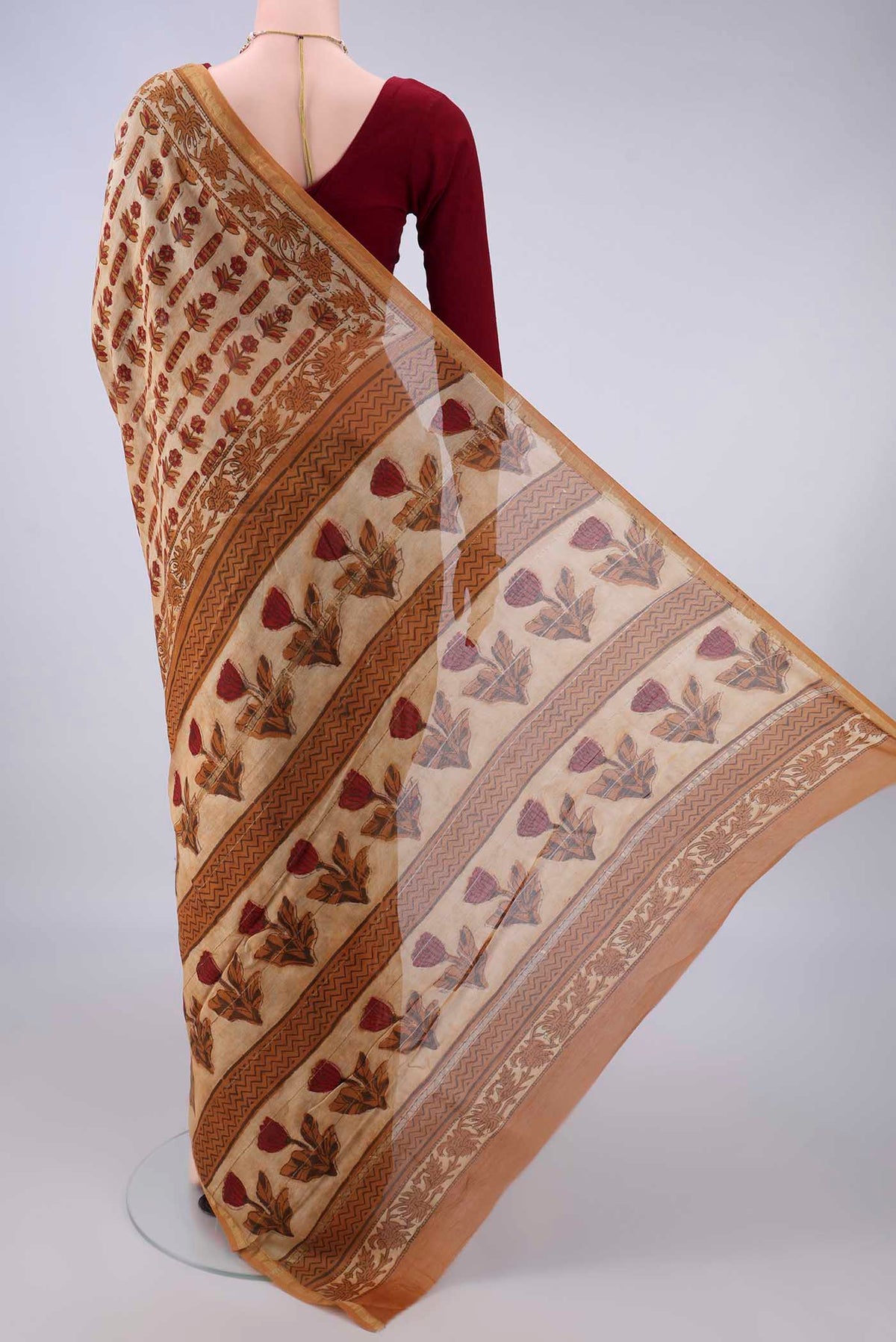 Flat view of Dark Beige Chanderi Cotton Saree with Batik Print on the body and Thin Zari Line. 
