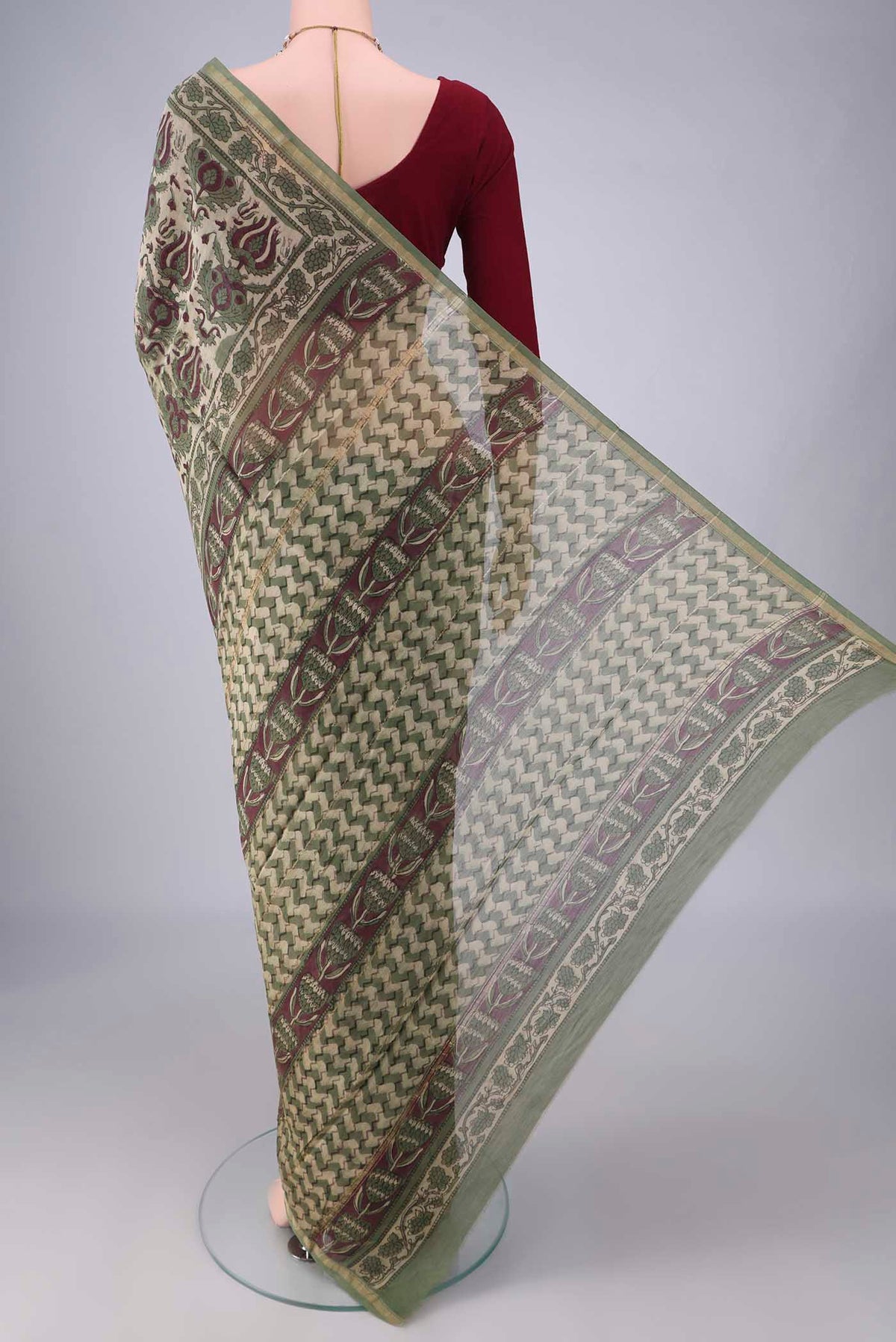 Flat view of Beige Chanderi Cotton Saree with Batik Print on the body and Zari Border. 