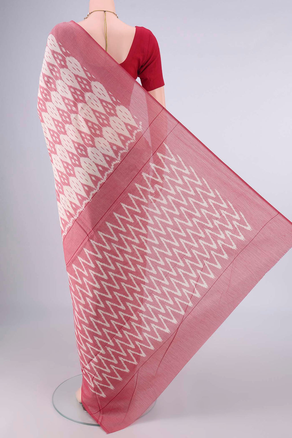 Flat view of Off White Pochampally Cotton Saree with Ikat design on the body and Plain Border. 