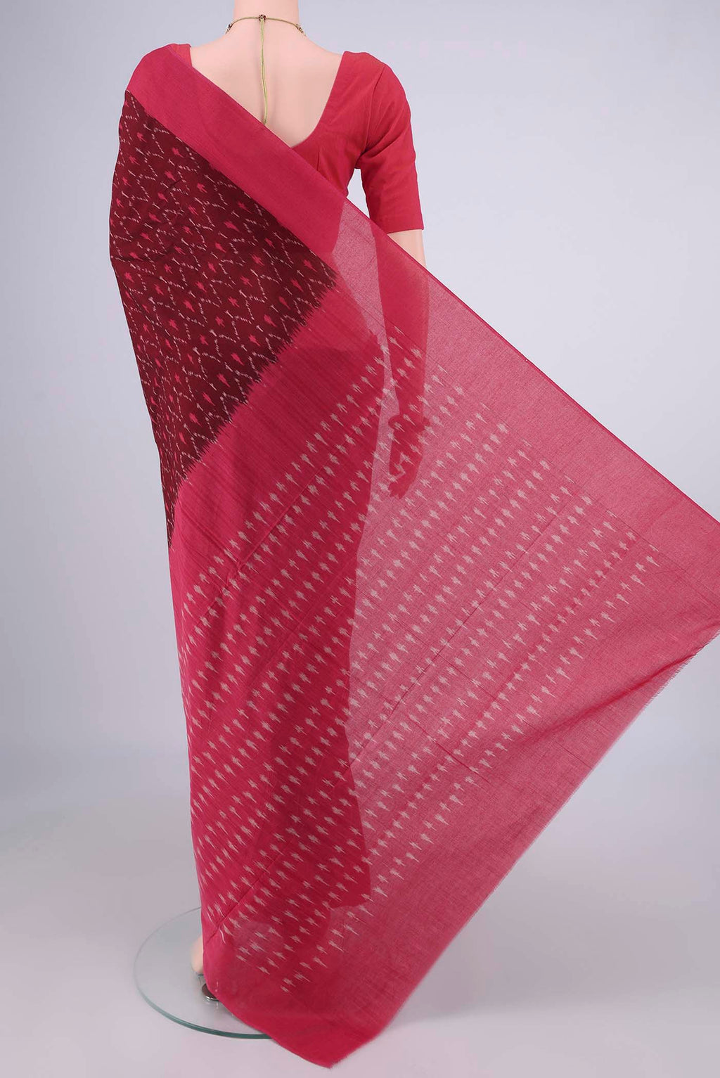 Flat view of Maroon Pochampally Cotton Saree with Ikat design on the body and Plain Border. 