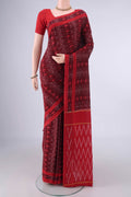 Maroon Pochampally Cotton Saree with Ikat design on the body and Ikat Border.  displayed on a mannequin