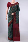 Bottle Green Pochampally Cotton Saree with Ikat design on the body and Ikat Border.  displayed on a mannequin