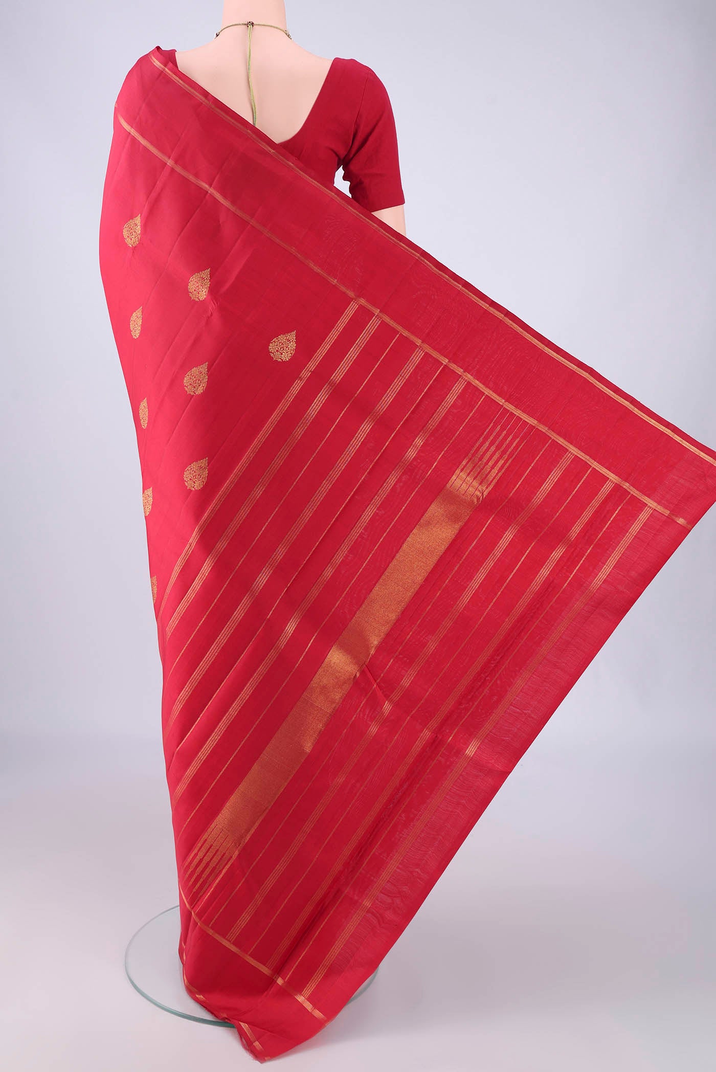 Flat view of Pure Silk Red Kanjivaram Silk Saree with Zari Butta on the body and Zari Border. 