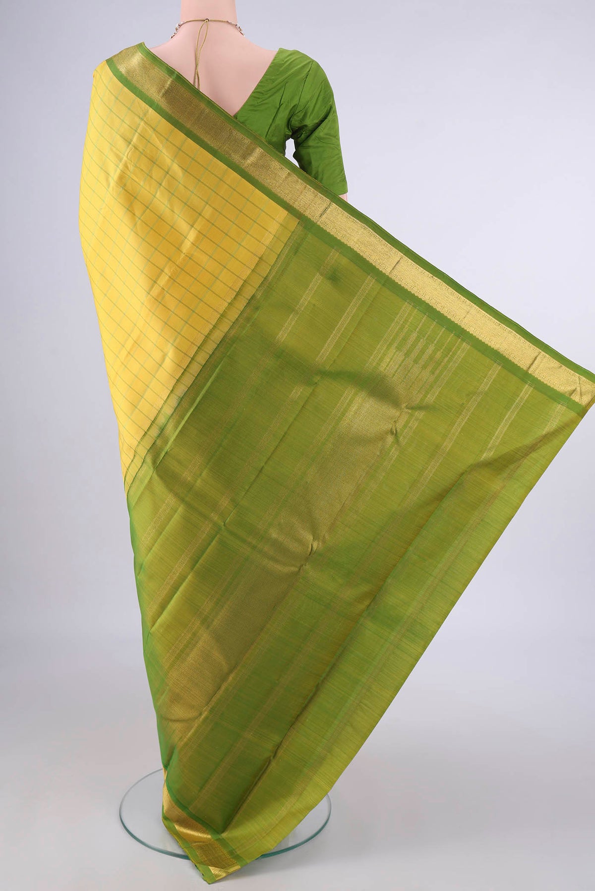 Flat view of Pure Silk Lemon Yellow Kanchipuram Saree with Checked design on the body and Zari Border. 